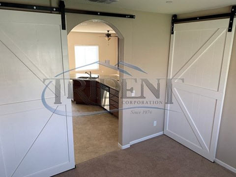 A room with a white door and a logo that reads "ENCORPORATION" on the wall.