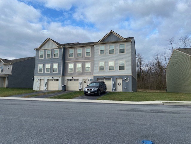 a car parked in front of an apartment building