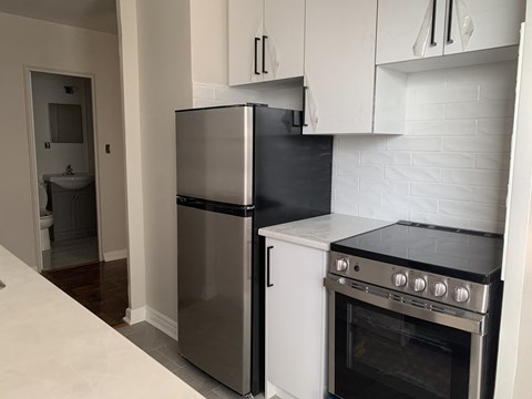 a kitchen with a stove and a refrigerator