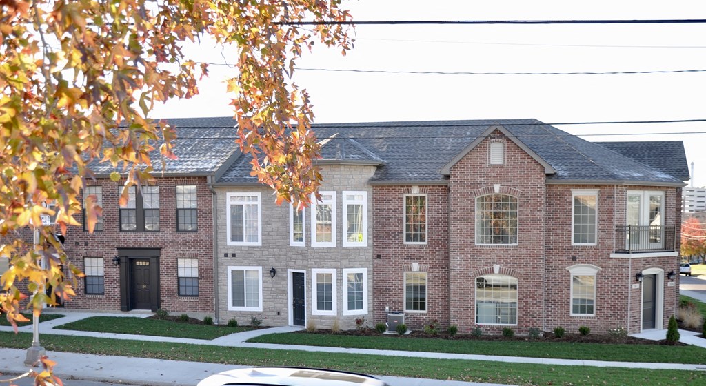an image of a house with a tree in front of it