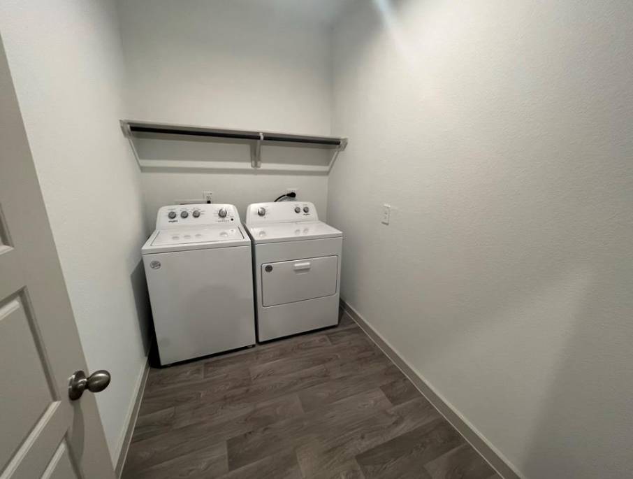 A laundry room with a washer and dryer.