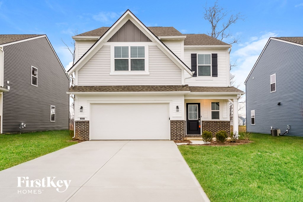 A house with a garage is for sale by FirstKey Homes.