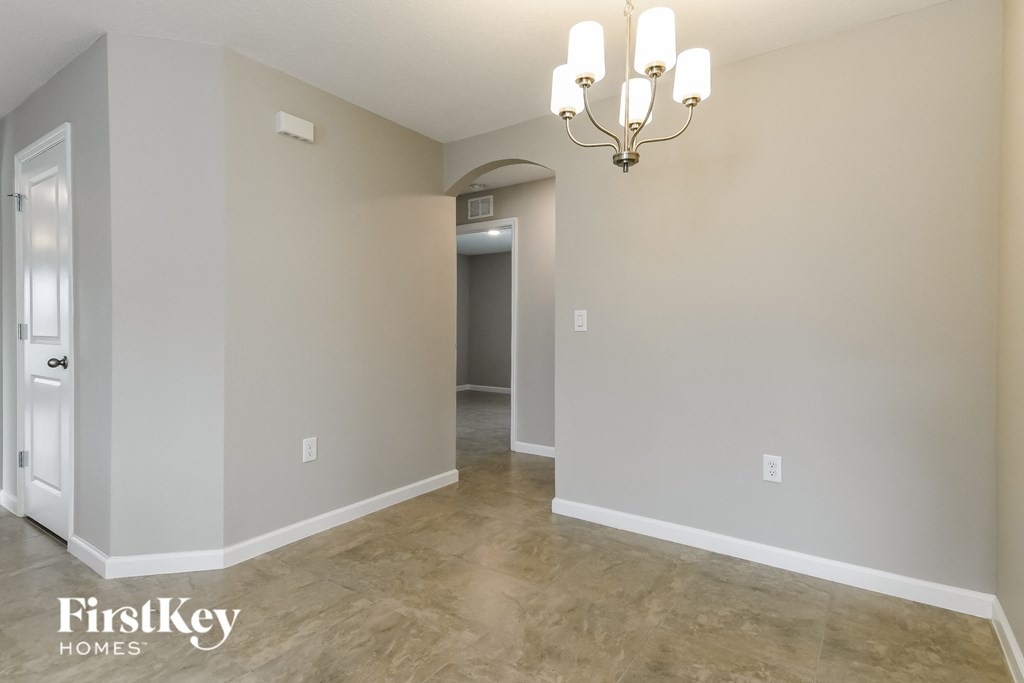 the living room and dining room are empty and ready to be remodeled