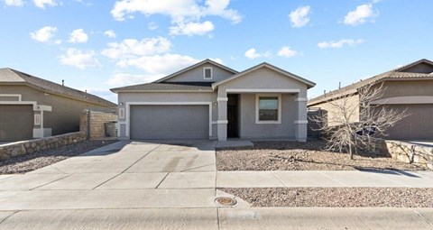 a house with a driveway and a garage door
