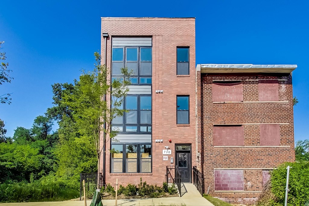 an old brick building with a blue sky in the background