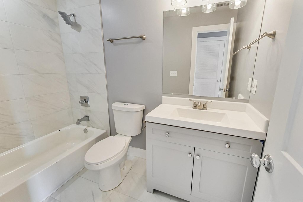 a bathroom with a sink toilet and a shower