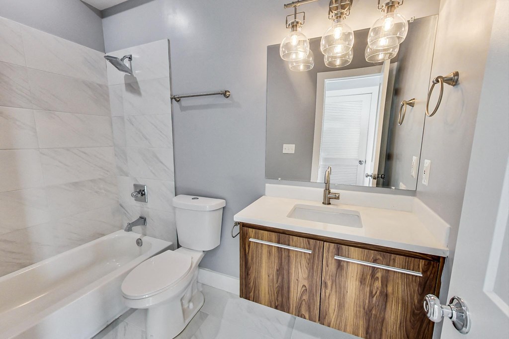 a bathroom with a sink toilet and a shower