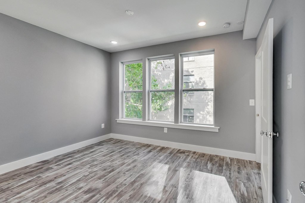the living room of a new home with a large window