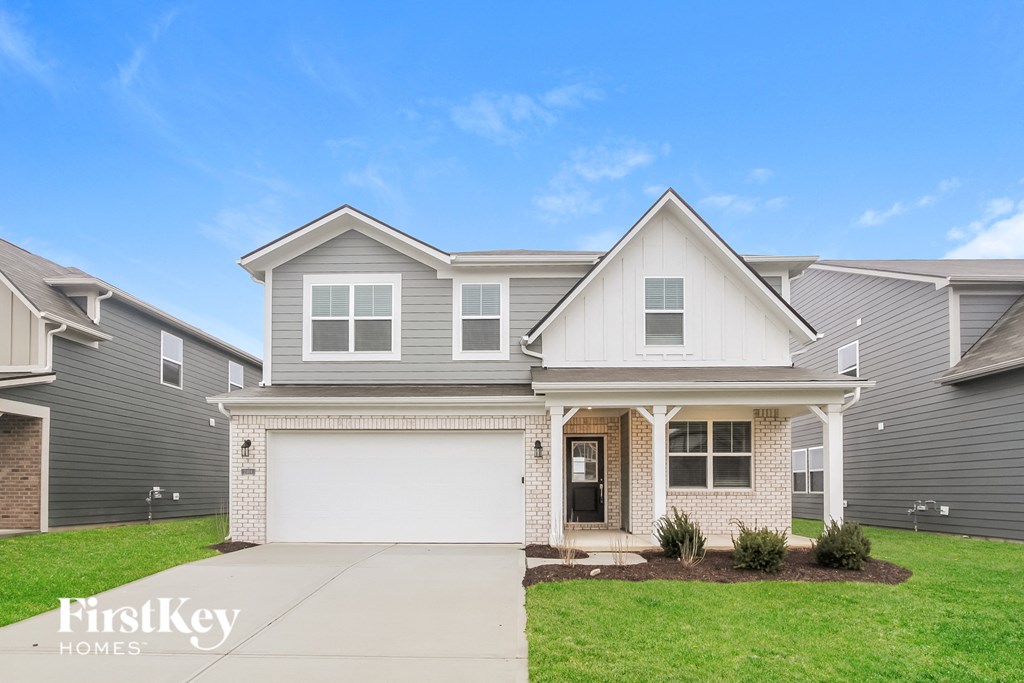A house with a garage is for sale by FirstKey Homes.