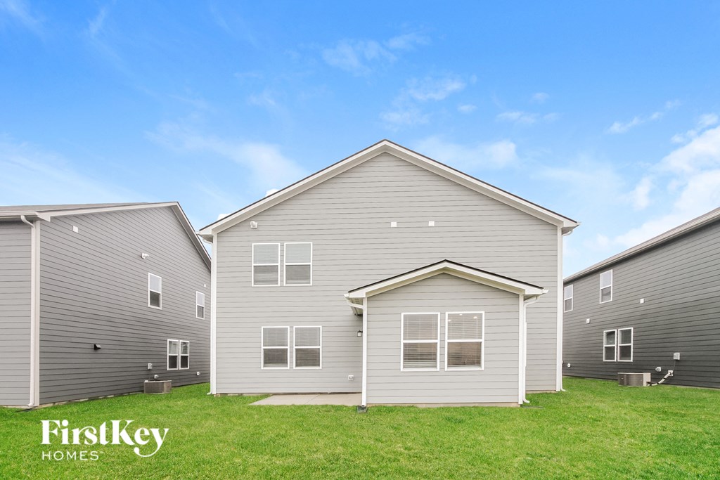 A row of houses with the words "FirstKey Homes" on the front.