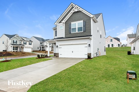 A house with a garage is shown in the image.