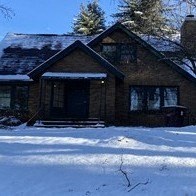 a house is covered in snow