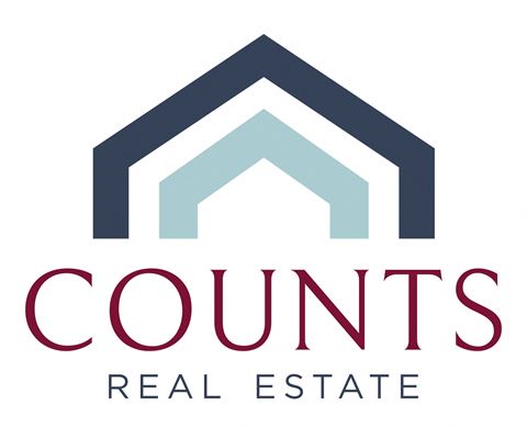 the logo of condos real estate with the word condos under it