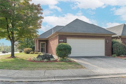 a brick house with a white garage door