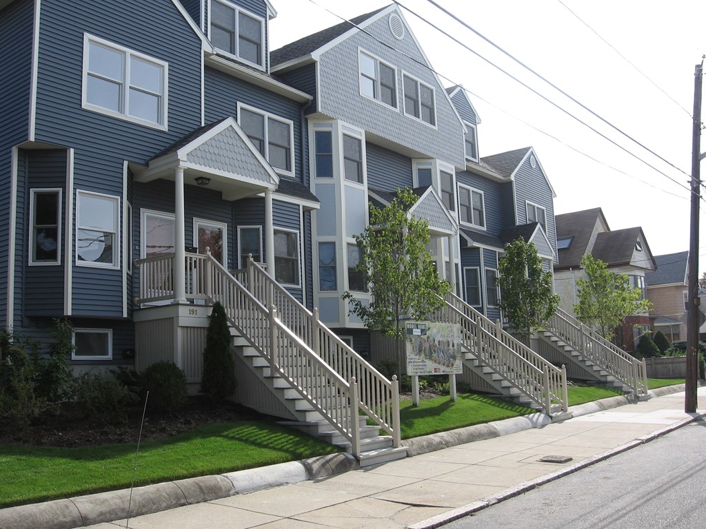 a row of houses on the side of a street