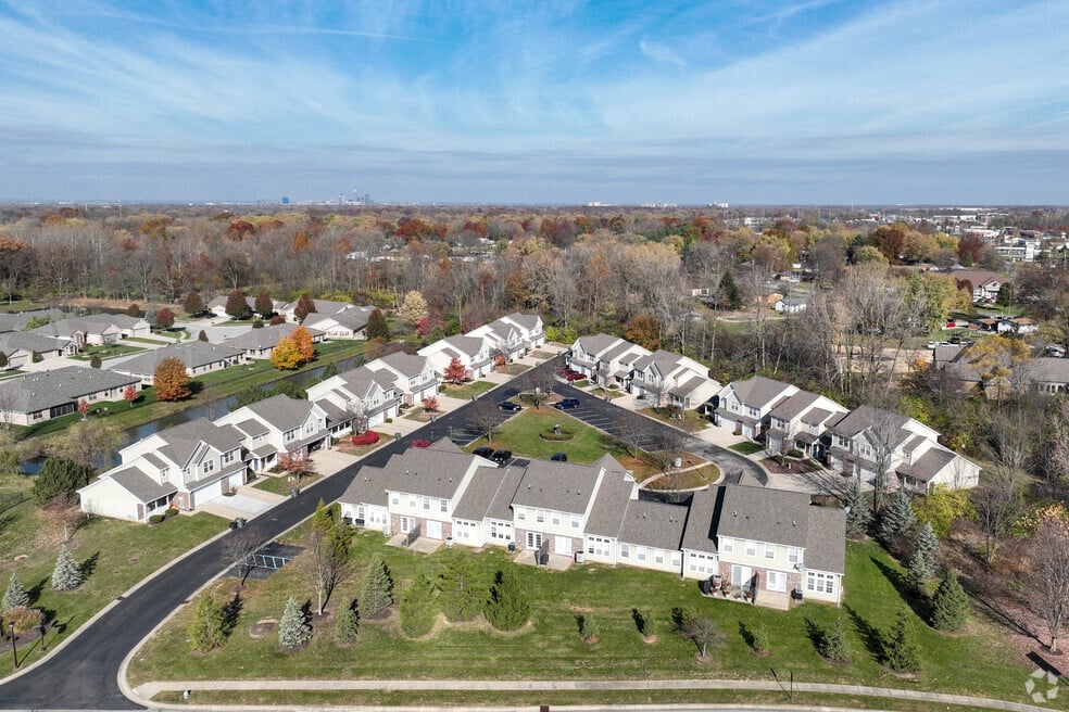 A suburban neighborhood with houses and trees.