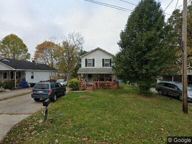 a house with a car parked in the yard