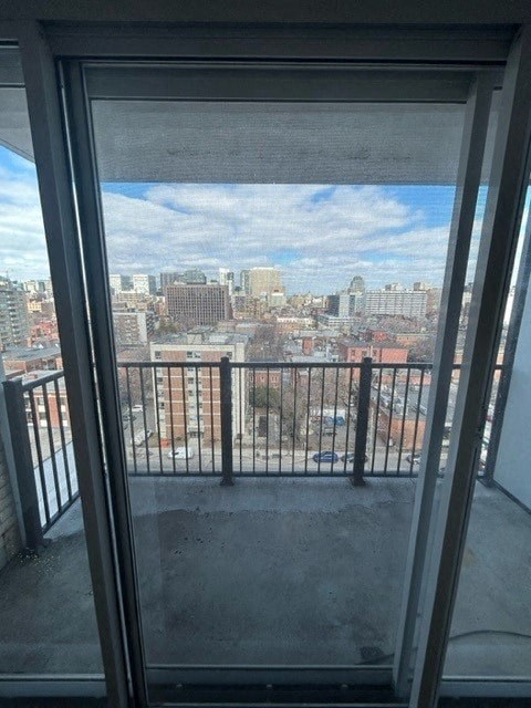 a view of a city from a glass window