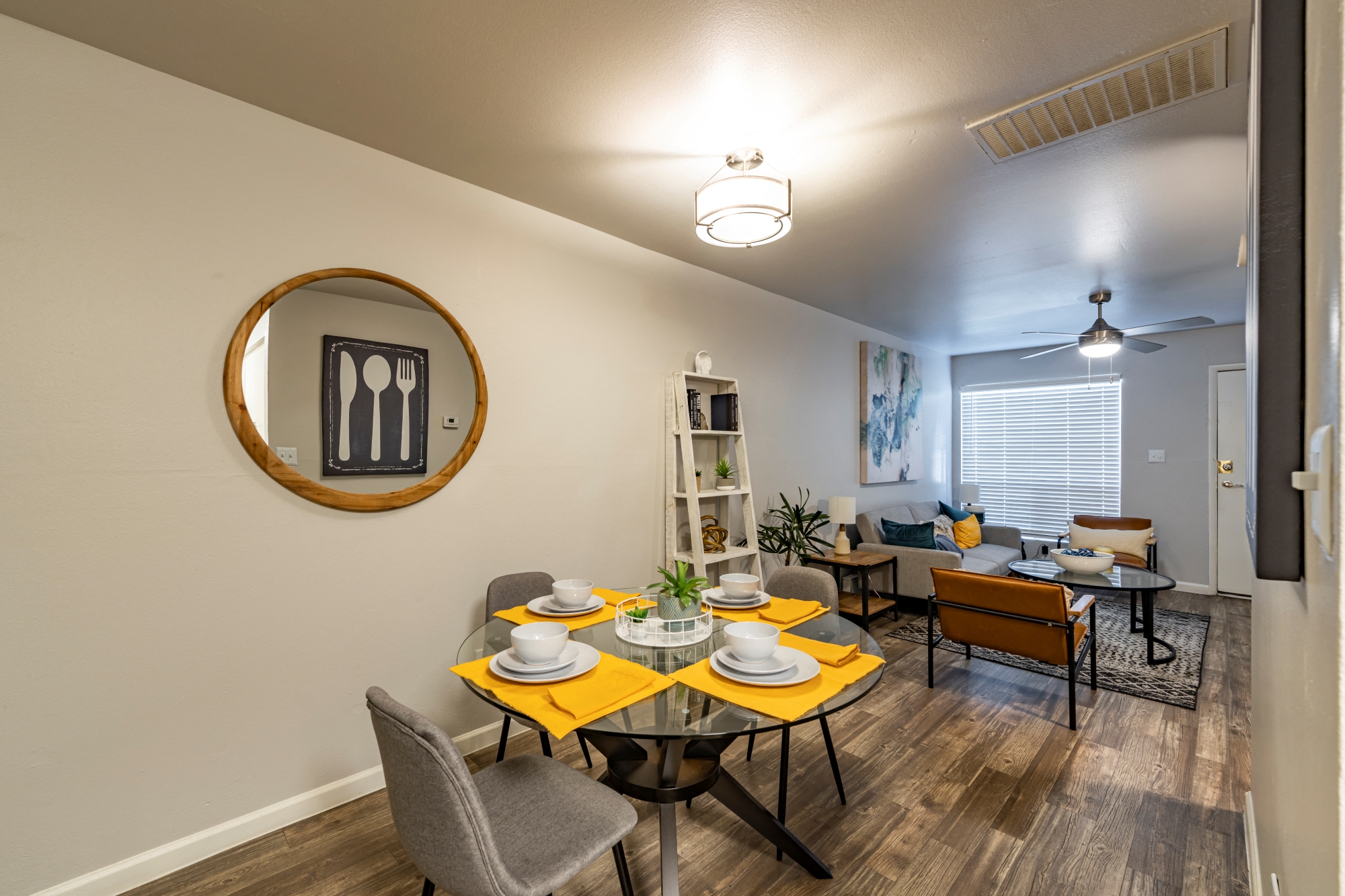 an open living room and dining room with a table and chairs