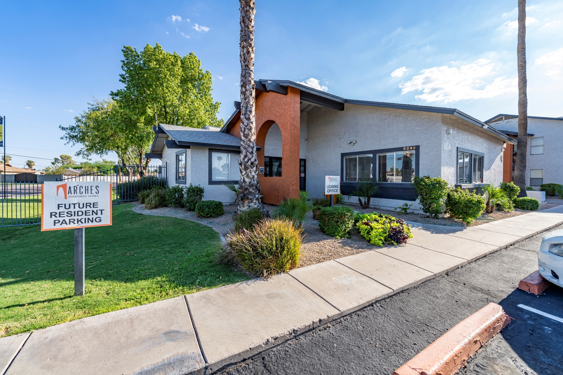 a white house with a sign in front of it
