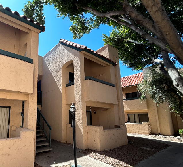 a building with a tree in front of it