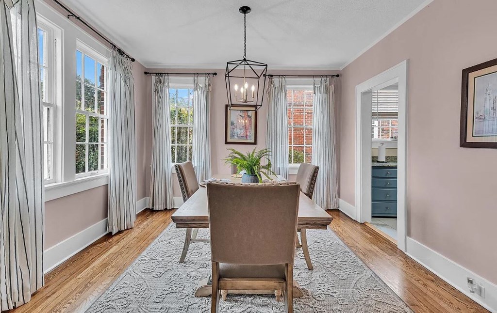 a dining room with a table and chairs