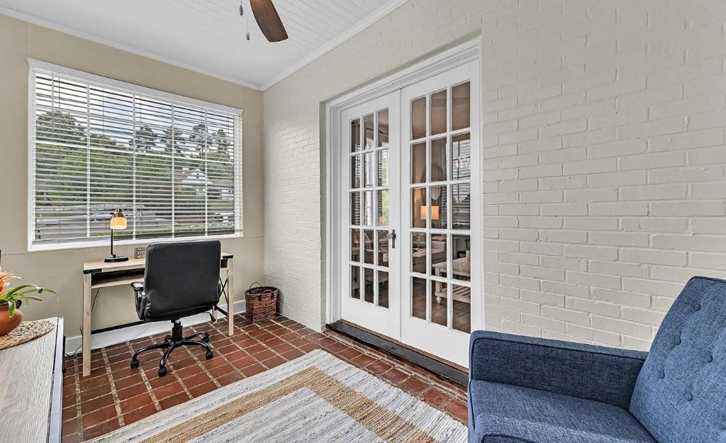 a home office with a chair and a desk