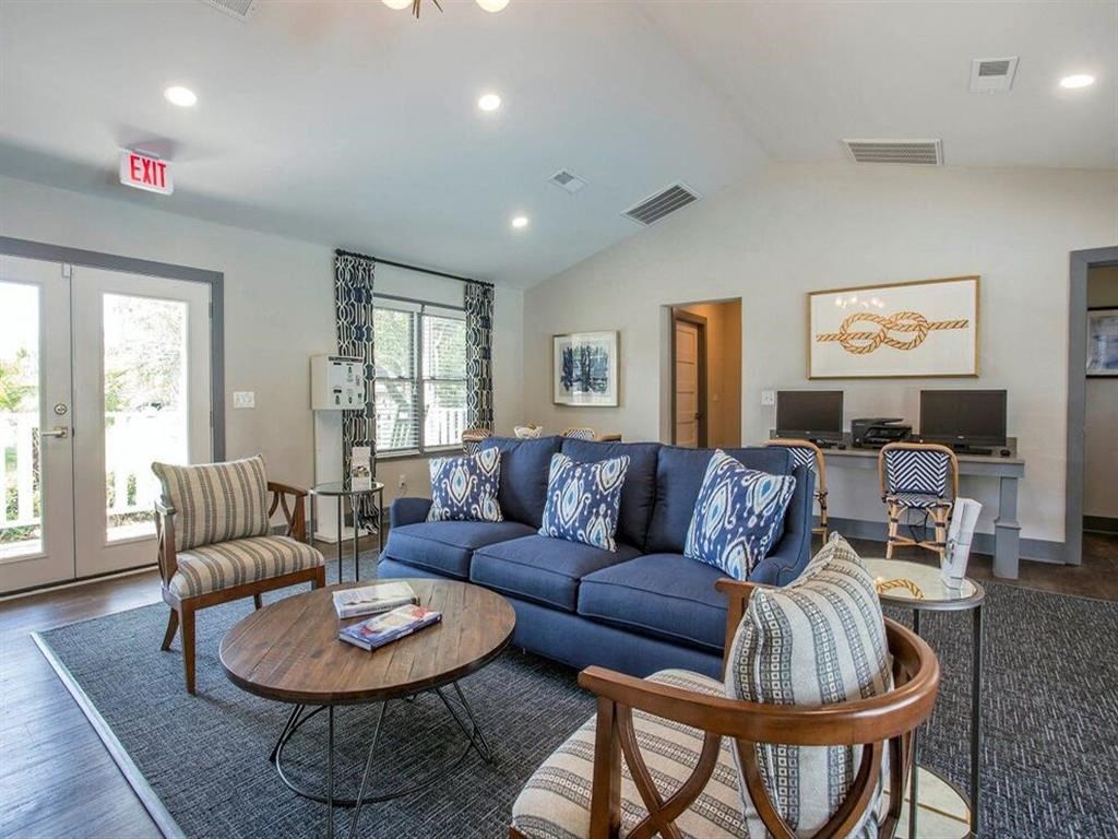 a living room with a blue couch and a coffee table
