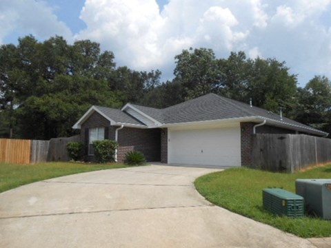 a house with a driveway and a garage door