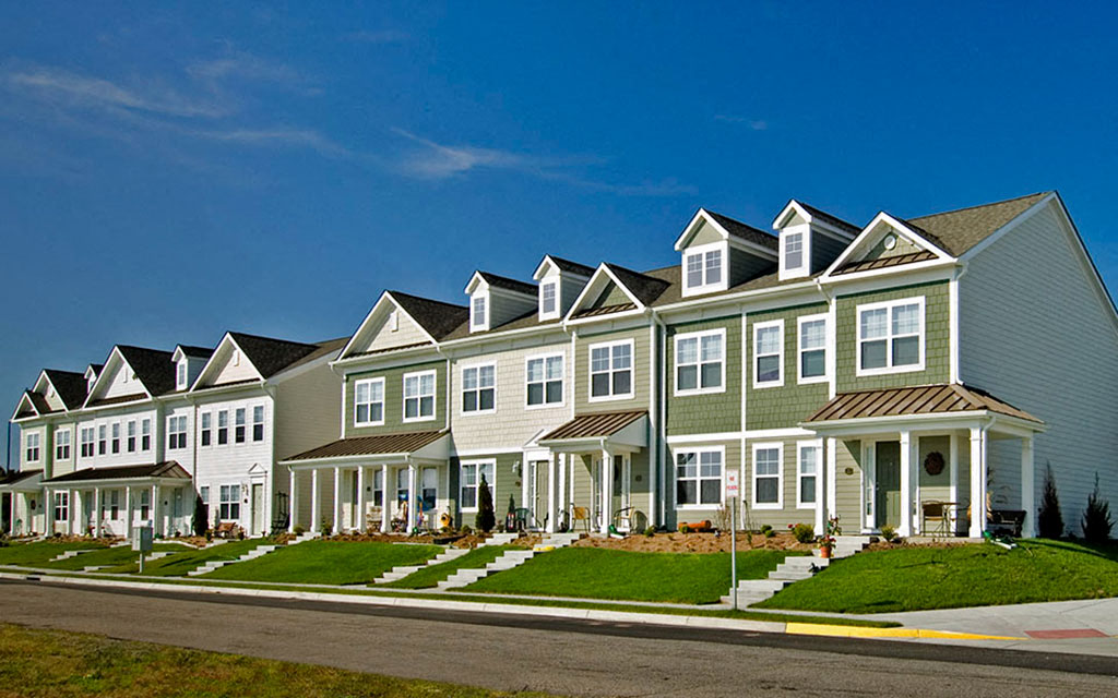 a row of houses on the side of a street