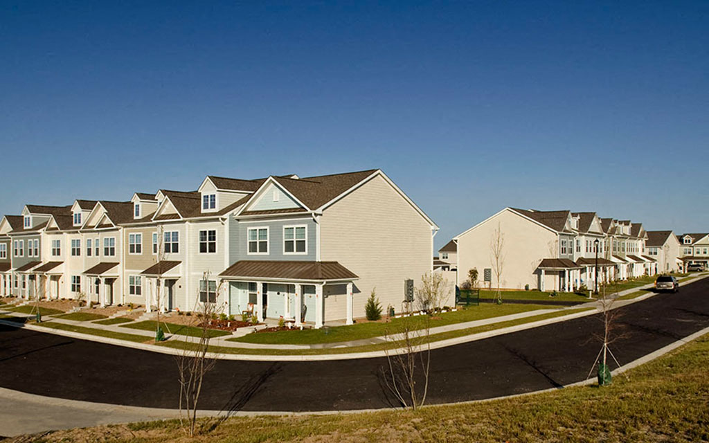 a row of houses on the side of a street