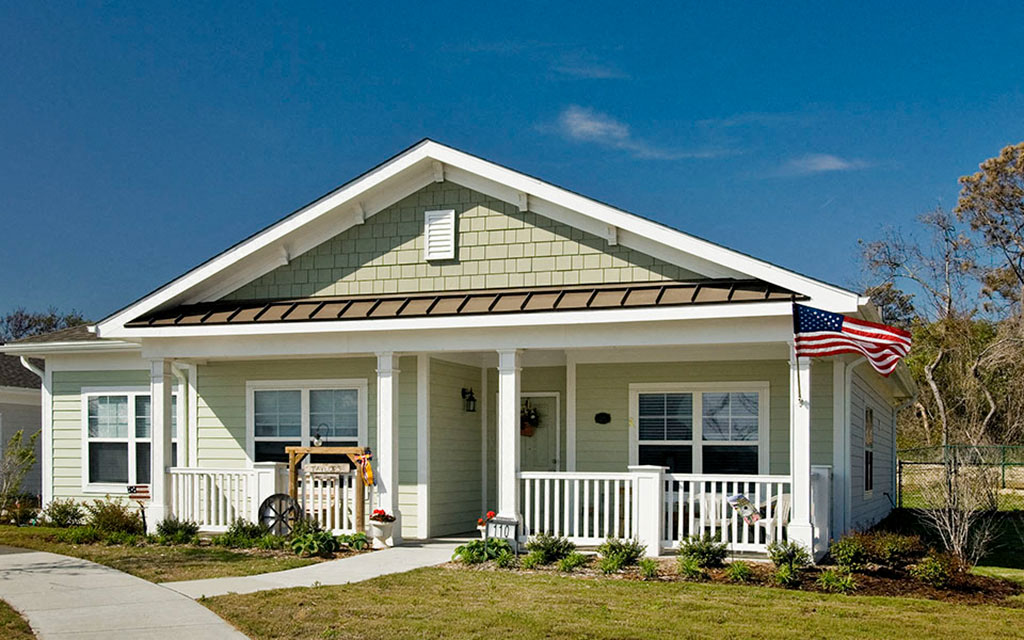 a house with an flag on the porch