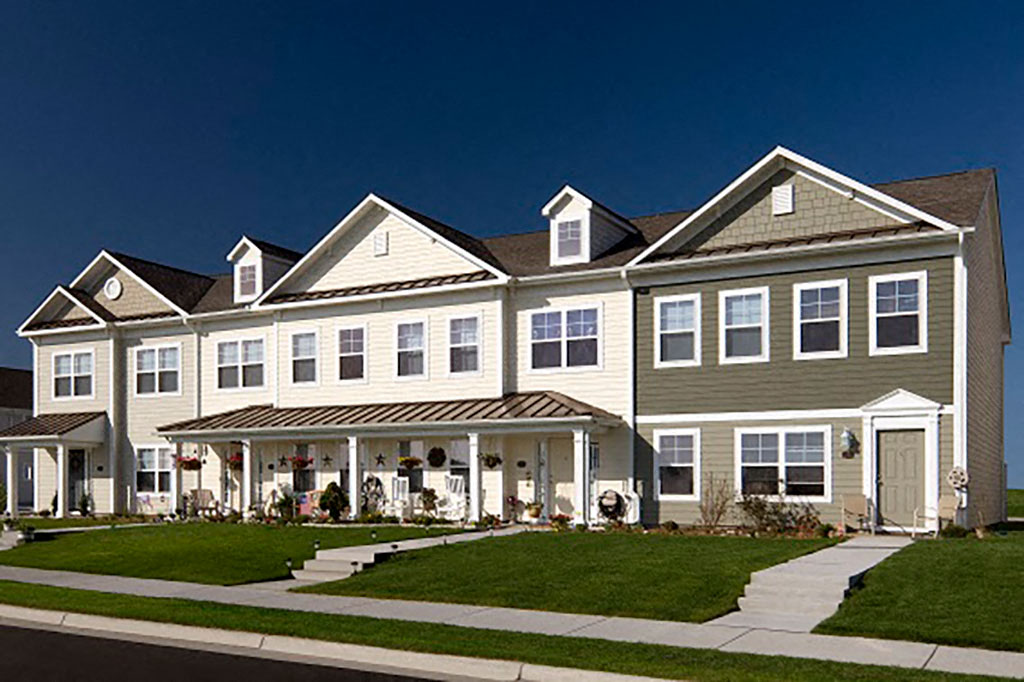 a row of houses on the side of a street