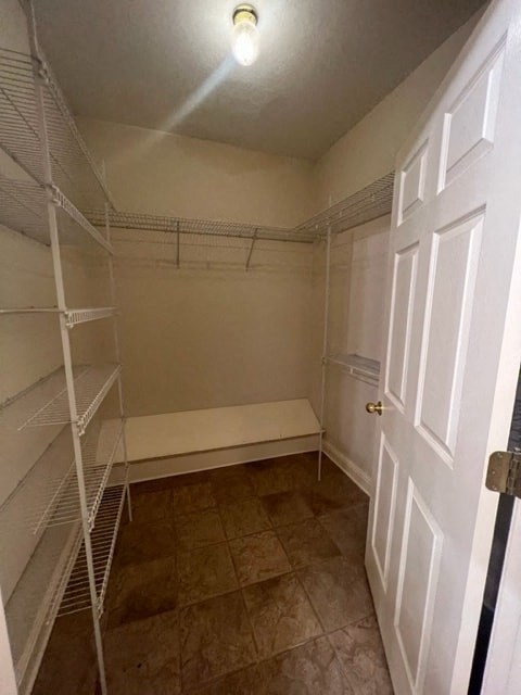 a room with a white closet and a door