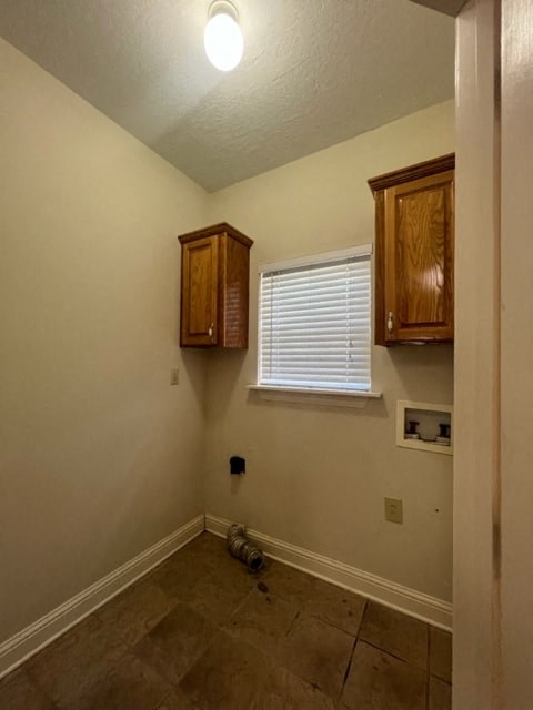 a empty room with cabinets and a window