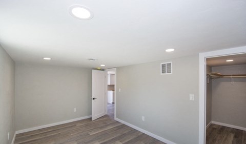 A room with a doorway leading to another room.