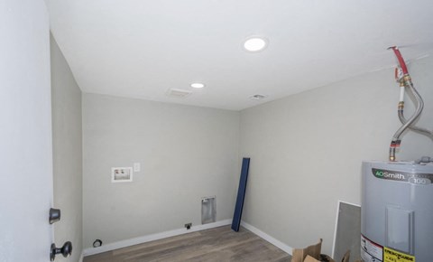 A room with a white ceiling and a white door.