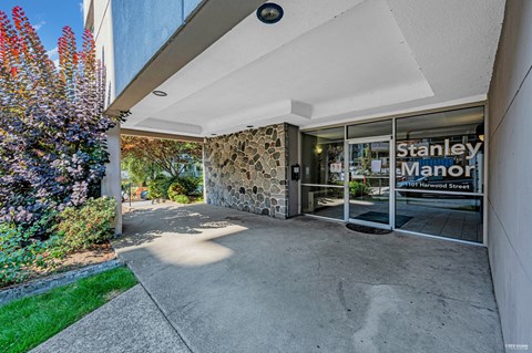 The entrance to the Stanley Manor apartment complex is shown.