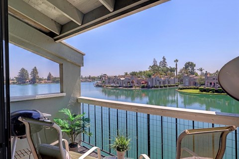 the view of the water from the balcony of a condo