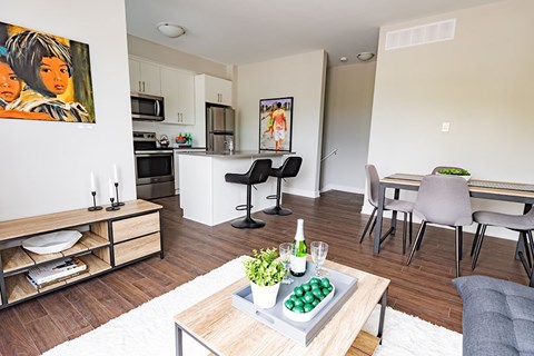 A modern kitchen with a dining table and chairs.