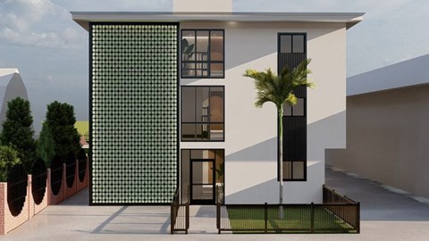 a building with a palm tree in front of it
