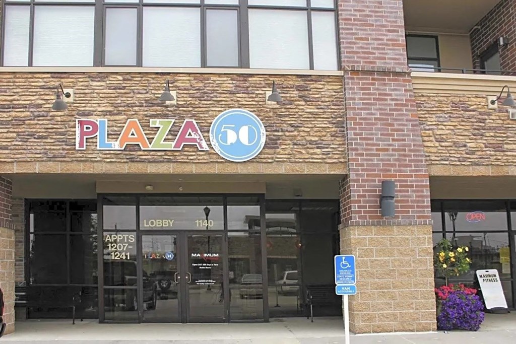 a building with a pizza 50 sign on the front of it