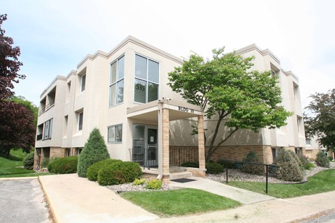 A beige building with the number 53 on it.