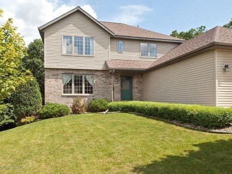 a house with a yard in front of it