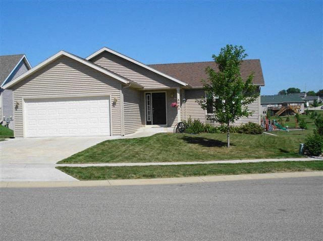 a house with a driveway and a garage door