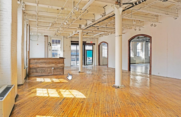 A room with wooden floors and white walls.