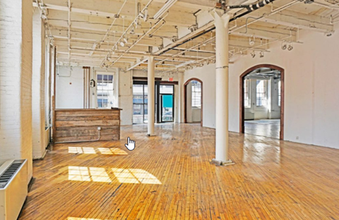 A room with wooden floors and white walls.