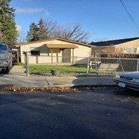 a house with a fence in front of it
