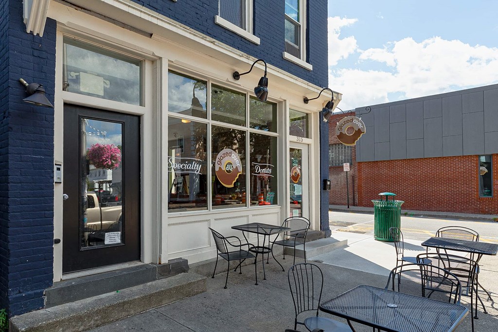 a patio outside of a restaurant with tables and chairs