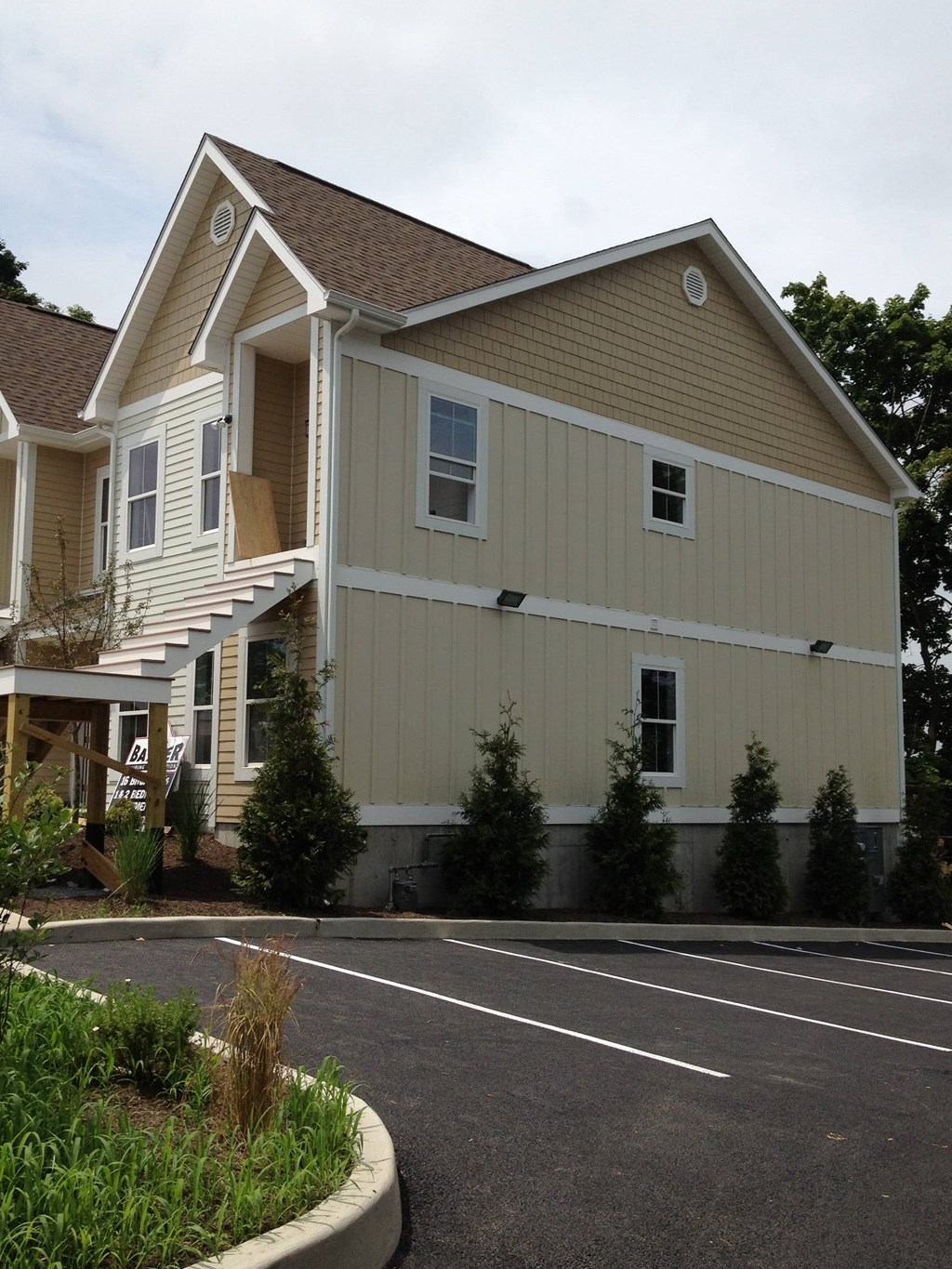 a house with a parking lot in front of it